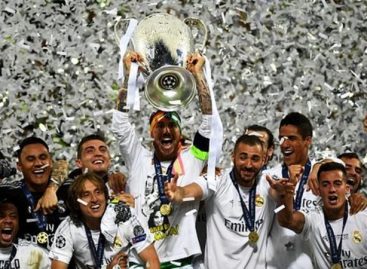 Real Madrid lift Champions League trophy after penalties